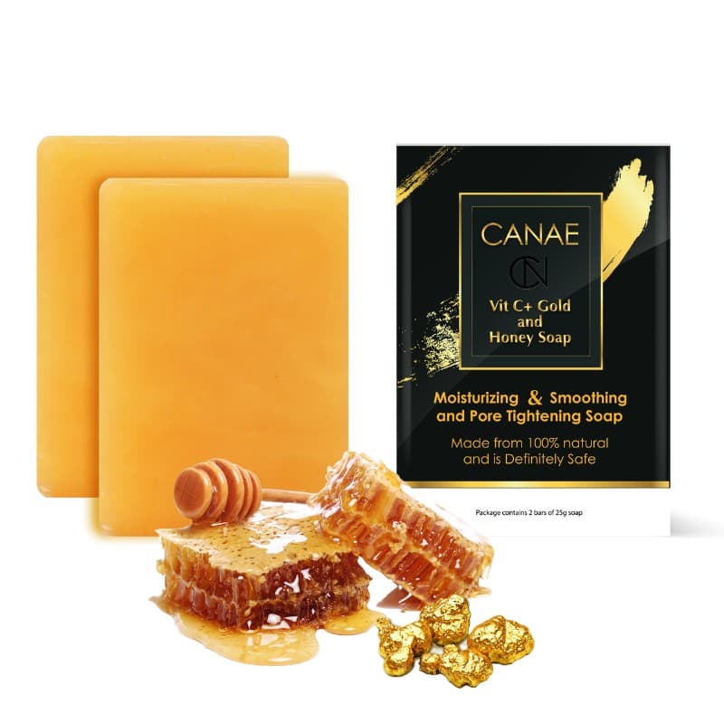 Two CANAE Vitamin C, Gold and Honey facial soap bars beside raw honeycomb